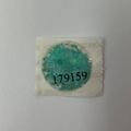 Small green stamp on a white background