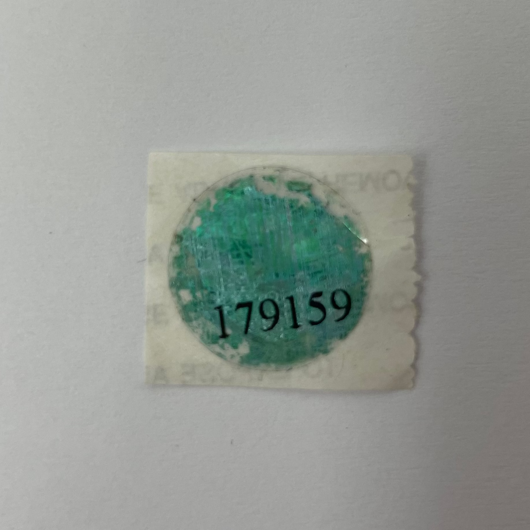 Small green stamp on a white background